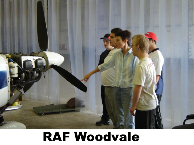 Students looking at the propellor of a small aeroplane at RAF Woodvale